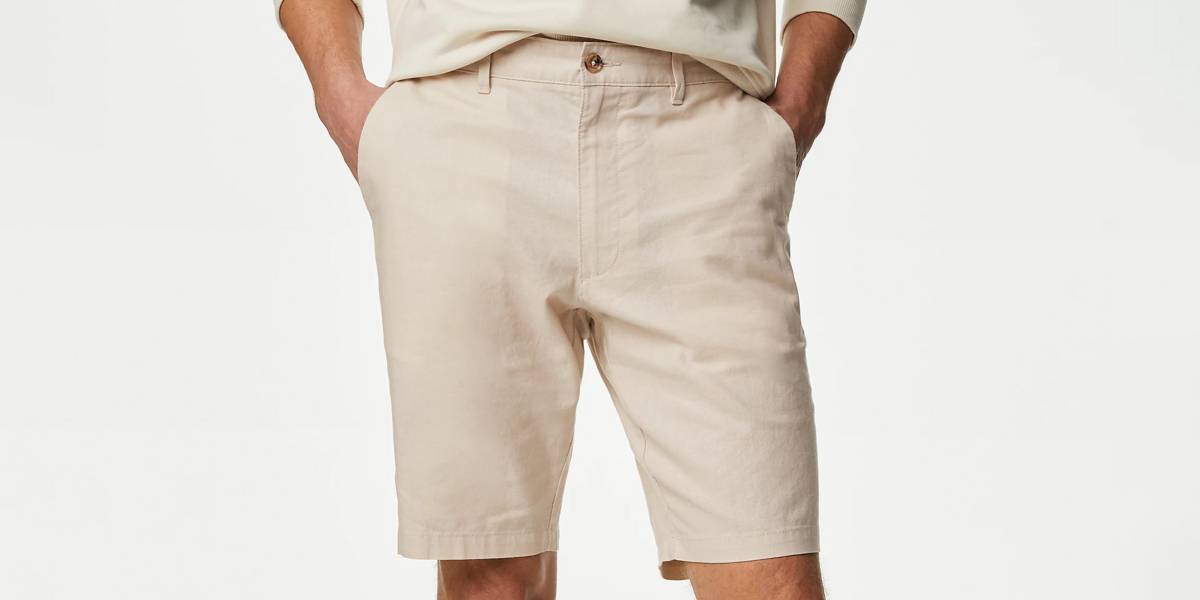 Man wearing grey polo shirt and white shorts 